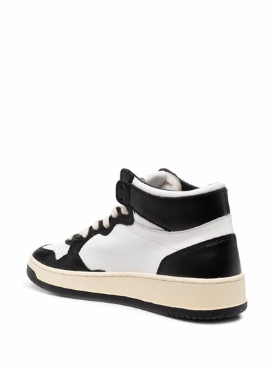 Shop Autry Medialist Mid Leather Sneakers In Black