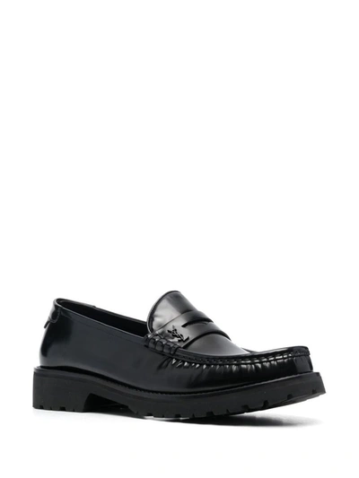 Shop Saint Laurent Leather Loafers In Black