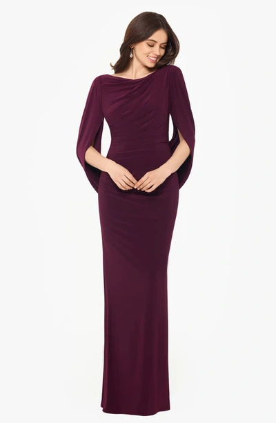 Shop Betsy & Adam Cape Long Sleeve Trumpet Gown In Wine