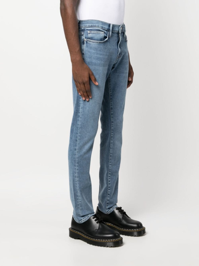 Shop Frame L'homme Slim-fit Tapered Jeans In Blue