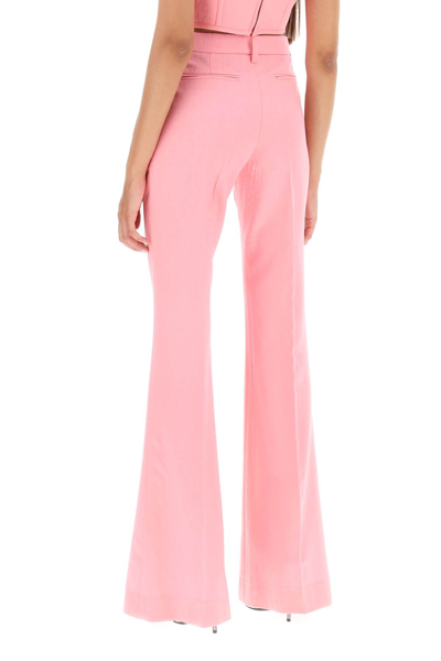 Shop Versace Low Waisted Flared Trousers In Pastel Pink (pink)