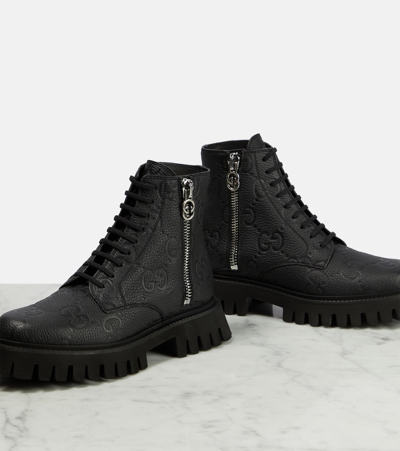 Shop Gucci Gg Leather Ankle Boots In Black