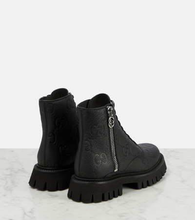 Shop Gucci Gg Leather Ankle Boots In Black