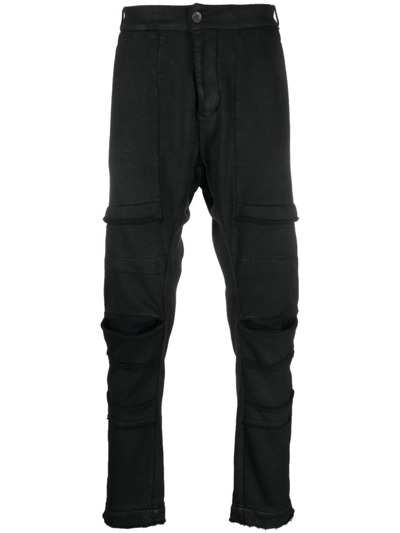 Shop Masnada Jersey Tapered-leg Trousers In Black