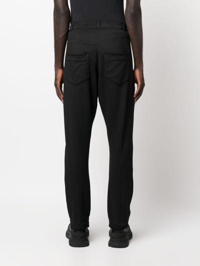 Shop Masnada Jersey Tapered-leg Trousers In Black