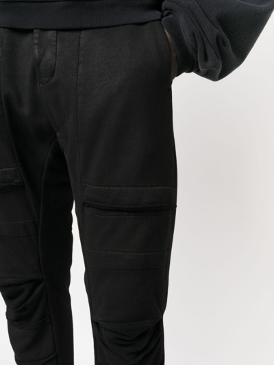 Shop Masnada Jersey Tapered-leg Trousers In Black