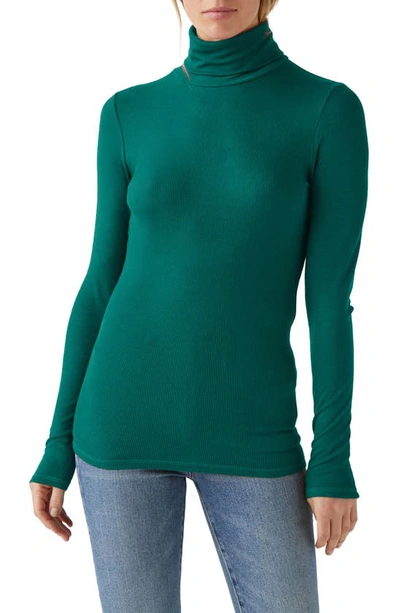 Shop Michael Stars Gail Ribbed Turtleneck Top In Ivy
