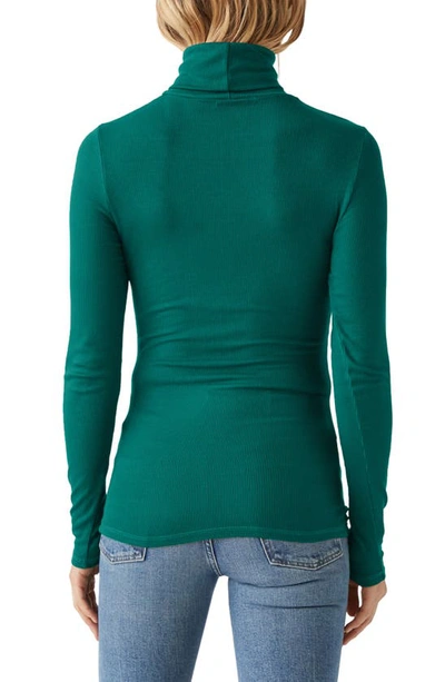 Shop Michael Stars Gail Ribbed Turtleneck Top In Ivy