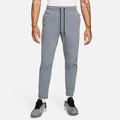 Shop Nike Men's Unlimited Dri-fit Straight Leg Versatile Pants In Smoke Grey/black/smoke Grey