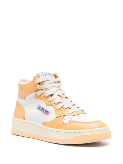 Shop Autry Medalist Mid Leather Sneakers In White