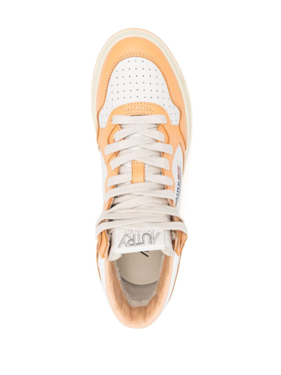Shop Autry Medalist Mid Leather Sneakers In White