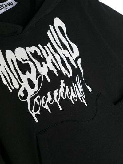 Shop Moschino Asymmetric Logo-print Hoodie In Black