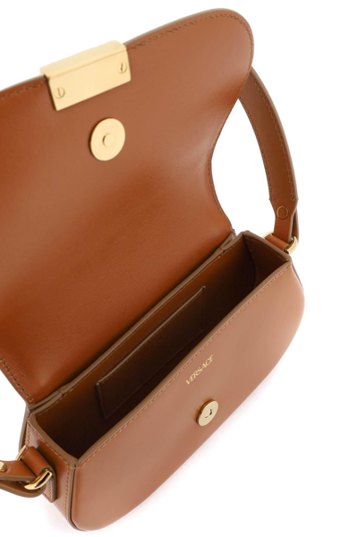 Shop Versace 'greca Goddess' Mini Shoulder Bag In Brown