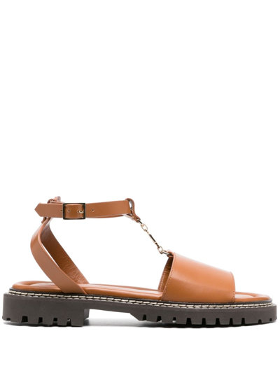 Shop Claudie Pierlot Logo-charm Leather Sandals In Brown