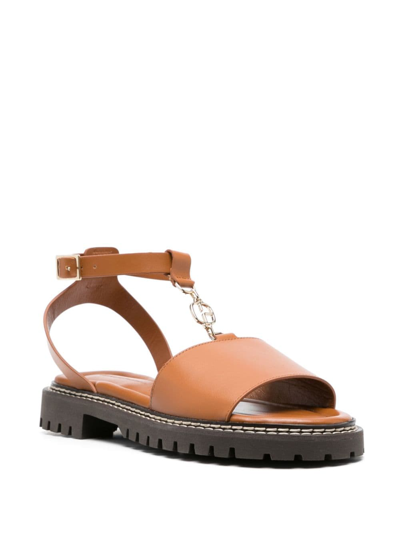 Shop Claudie Pierlot Logo-charm Leather Sandals In Brown