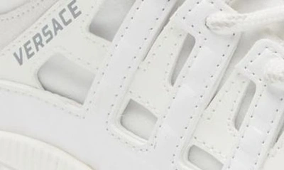 Shop Versace Kids' Trigreca Sneaker In White