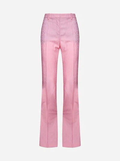 Shop Versace Logo Wool Trousers In Pastel Pink