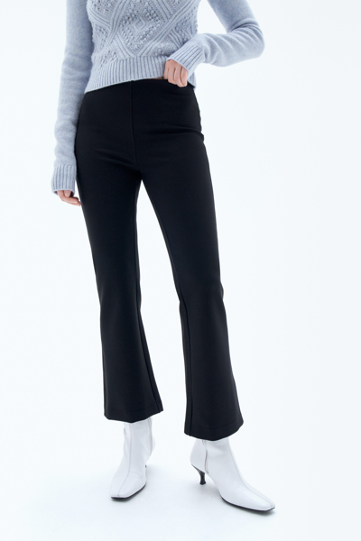 Shop Filippa K Flared Jersey Trousers In Black