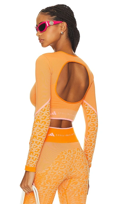Shop Adidas By Stella Mccartney True Strength Seamless Yoga Long Sleeve Top In Orange