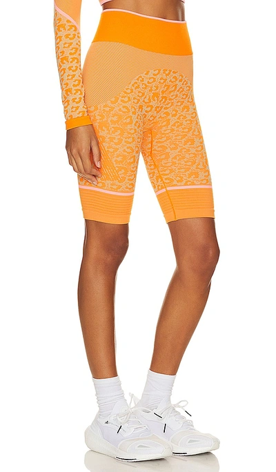 Shop Adidas By Stella Mccartney True Strength Seamless Yoga Bike Legging In Orange