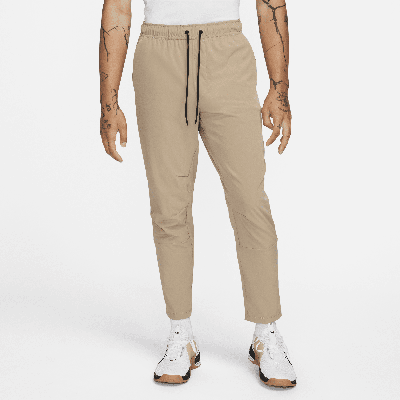 Shop Nike Men's Unlimited Dri-fit Tapered Leg Versatile Pants In Brown