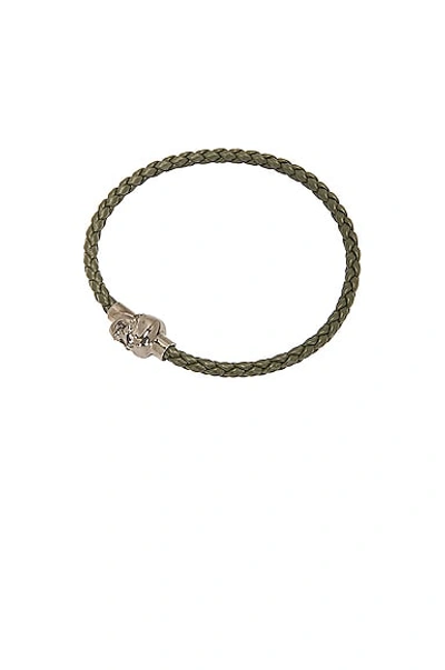 Shop Alexander Mcqueen Leather Cord Skull Bracelet In Military Green