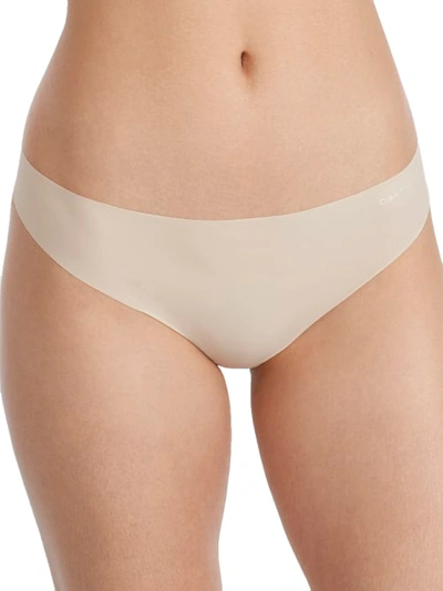 Shop Calvin Klein Invisibles Thong In Mudstone