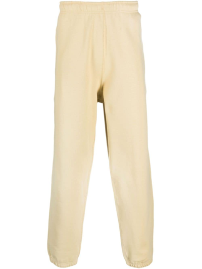 Shop Nike Swoosh Logo-embroidered Track Pants In Yellow