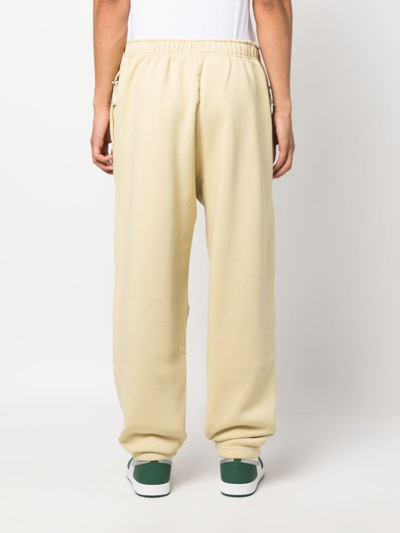 Shop Nike Swoosh Logo-embroidered Track Pants In Yellow