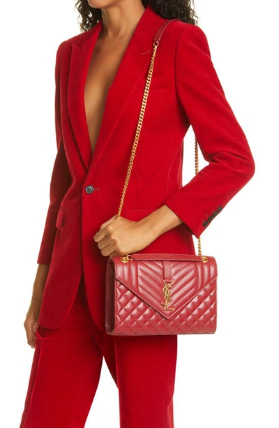 Shop Saint Laurent Medium Cassandra Quilted Leather Envelope Bag In Red
