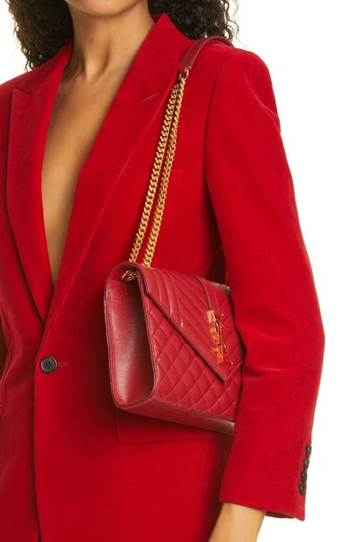Shop Saint Laurent Medium Cassandra Quilted Leather Envelope Bag In Red