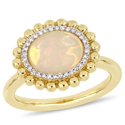 Mimi & Max 2 Ct Tgw Oval-cut Yellow Ethiopian Opal And 1/10 Ct Tw Diamond Halo Ring In 14k Yellow Gold In Yellow