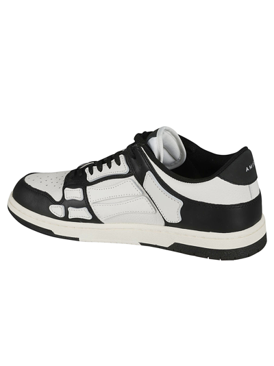Shop Amiri Skel Leather Low Sneakers In Black/white