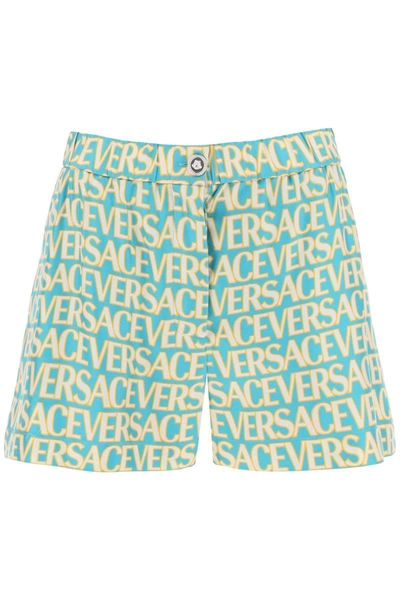 Shop Versace Monogram Print Silk Shorts In Blue