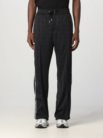 Shop Versace Pants In Cotton In Black