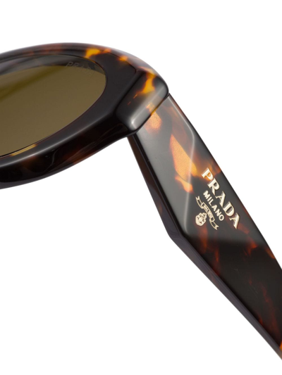 Shop Prada Symbole Oval-frame Sunglasses In Brown