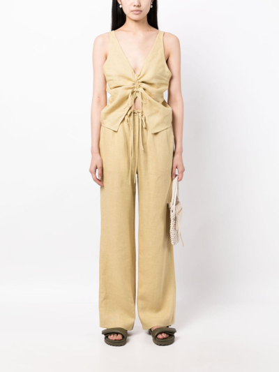 Shop Nanushka Drawstring -waist Linen Trousers In 黄色