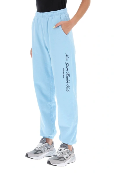 Shop Sporty And Rich 'ny Health Club' Flocked Sweatpants