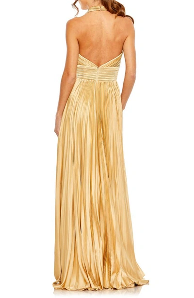Shop Mac Duggal Pleated Halter Neck Satin Gown In Gold