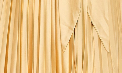 Shop Mac Duggal Pleated Halter Neck Satin Gown In Gold