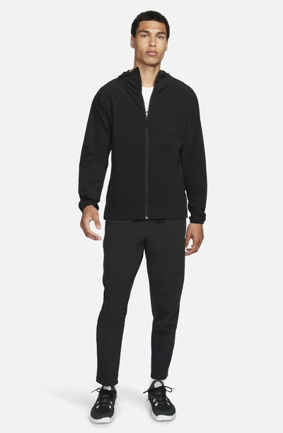 Shop Nike Dri-fit Unlimited Drawstring Pants In Black/ Black/ Black