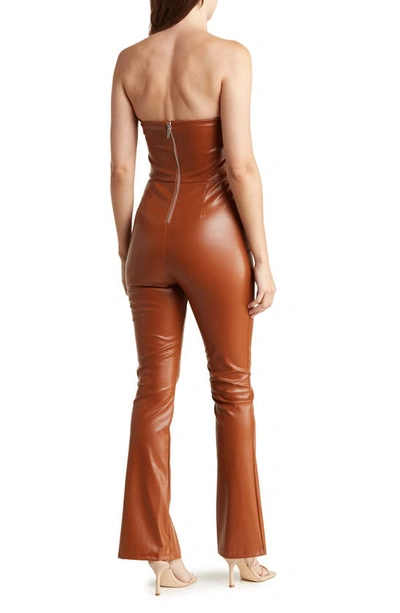 Shop Bebe Strapless Faux Leather Jumpsuit In Copper