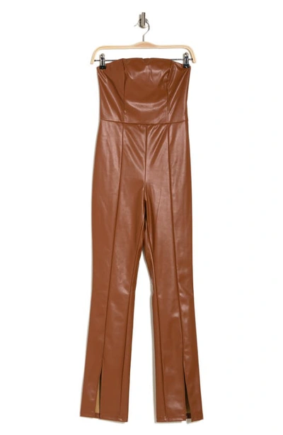 Shop Bebe Strapless Faux Leather Jumpsuit In Copper
