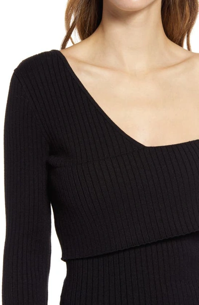 Shop Bebe Asymmetrical Off The Shoulder Sweater Dress In Black