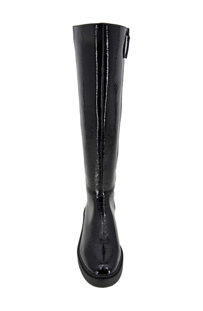 Shop Andre Assous Viva Knee High Boot In Black Crinkle Patent