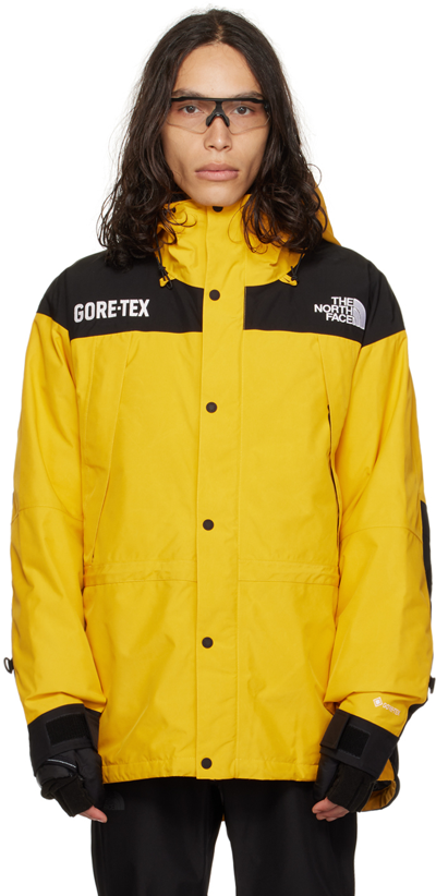 Shop The North Face Yellow Gtx Mountain Down Jacket In Zu3 Summit Gold/tnf