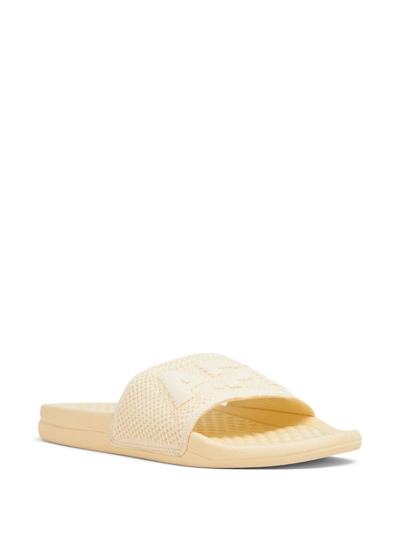 Shop Apl Athletic Propulsion Labs Embossed-logo Knitted Slides In Yellow