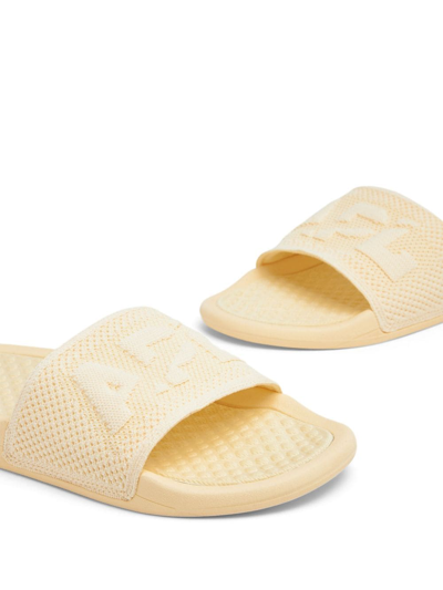 Shop Apl Athletic Propulsion Labs Embossed-logo Knitted Slides In Yellow