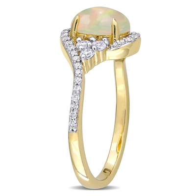 Mimi & Max 1 Ct Tgw Ethiopian Yellow Opal, White Sapphire And 1/5 Ct Tw Diamond Oval Halo Twist Ring In 10k Yel In Silver