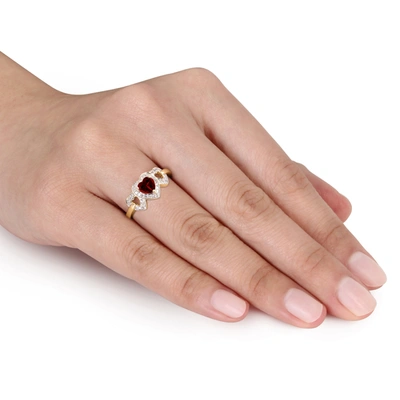 Mimi & Max Garnet Triple Heart Ring With 1/8 Ct Tw Diamonds In 10k Yellow Gold In Red